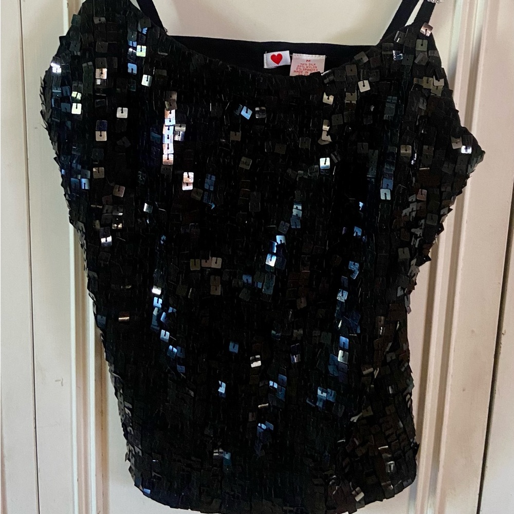 Cute little shirt to wear under jacket or sweater. Black size Medium. Never worn